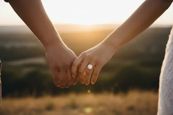 Couple holding hands - engagement moment