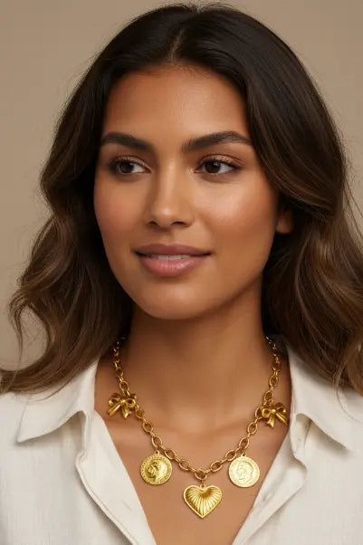 Gold charm necklace worn by model