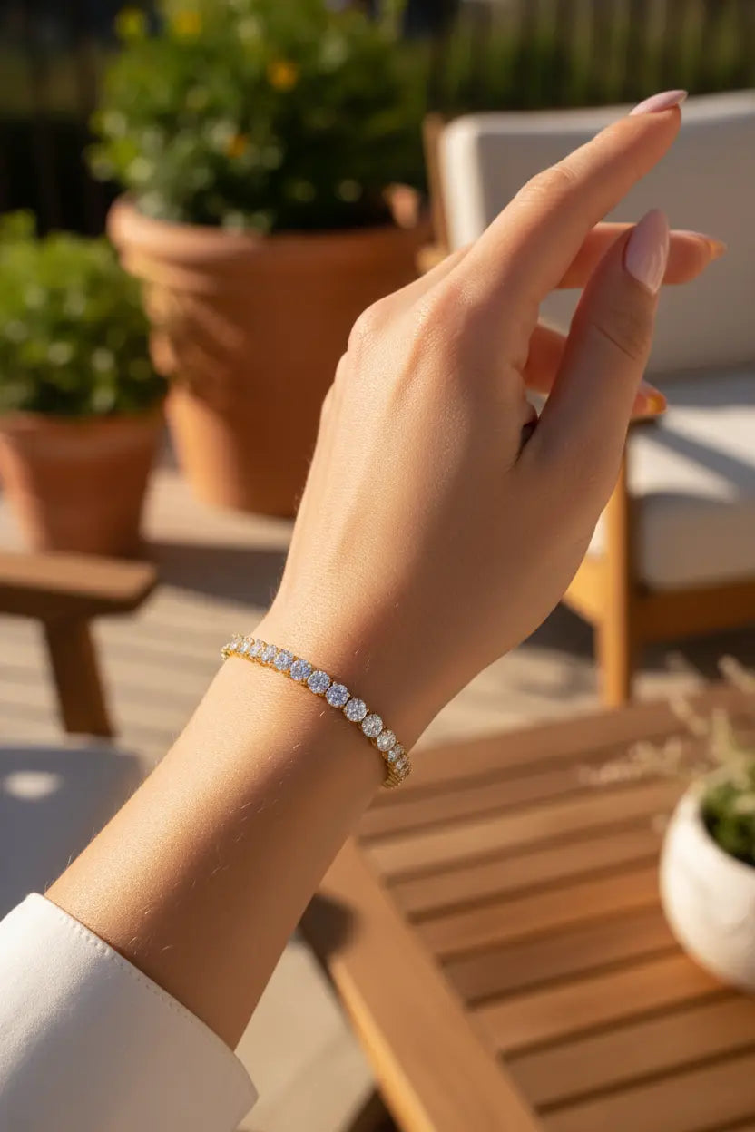 Model wearing gold tennis bracelet