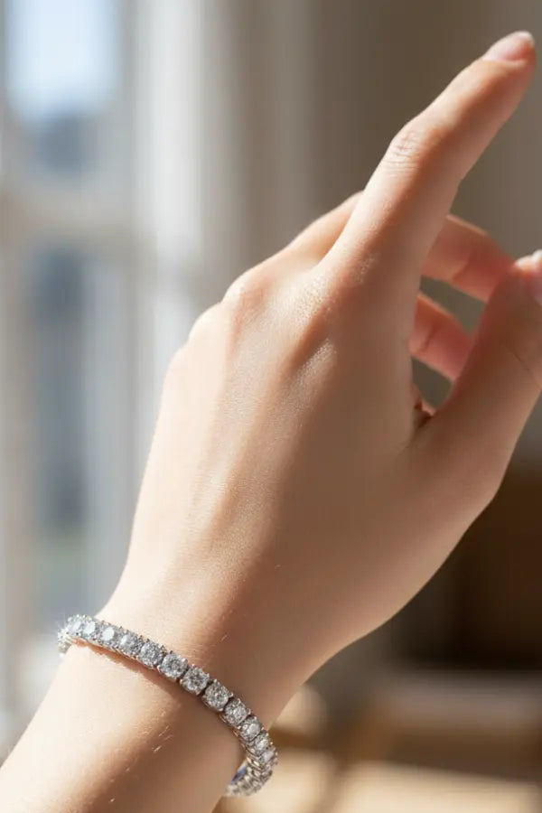 Model wearing silver tennis bracelet